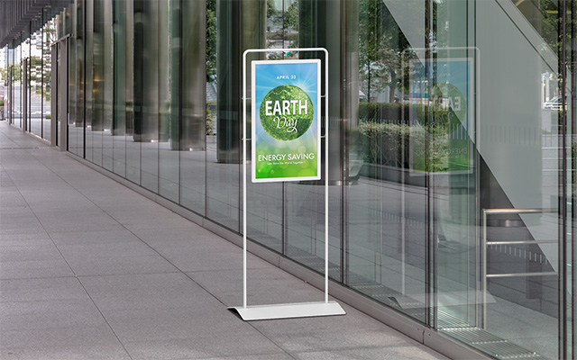 floor standing signage outside a glass fronted building