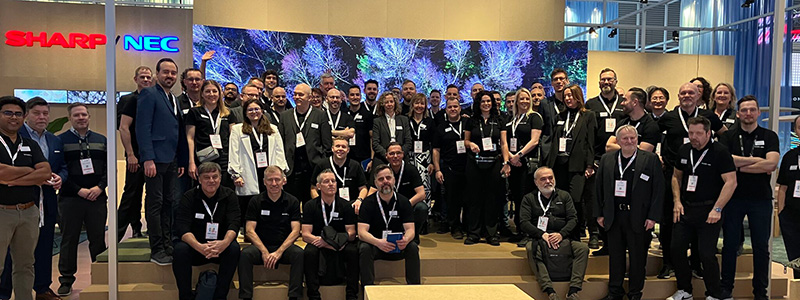 large group of people on an exhibition stand